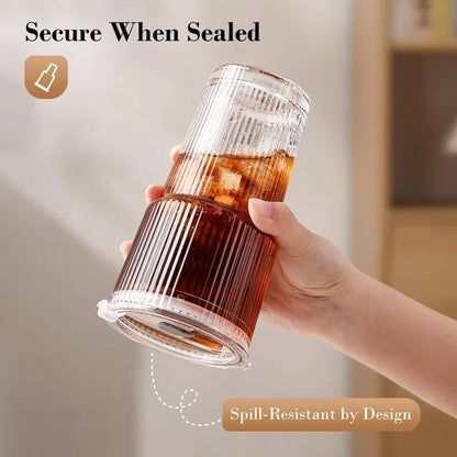 Ribbed glass drinking cup with lid and straw