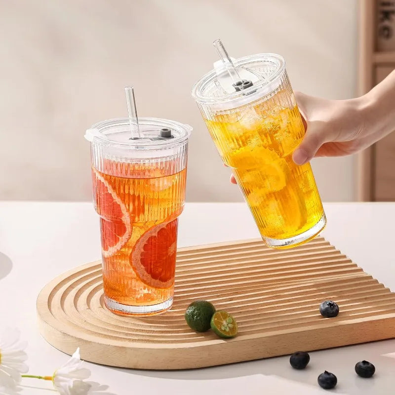 Ribbed glass drinking cup with lid and straw